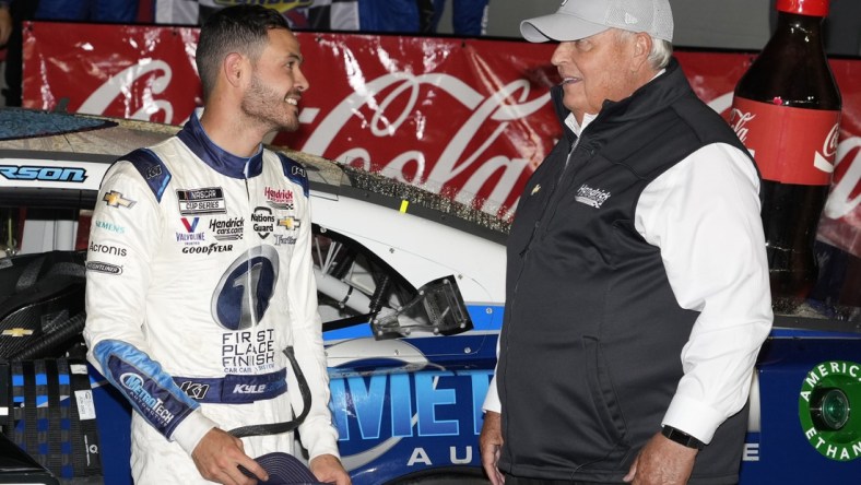 May 30, 2021; Concord, North Carolina, USA;  NASCAR Cup Series driver Kyle Larson (5) talks with team owner Rick Hendrick on his winning the Coca-Cola 600 at Charlotte Motor Speedway. Mandatory Credit: Jim Dedmon-USA TODAY Sports