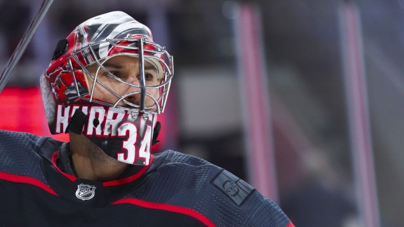 Jun 1, 2021; Raleigh, North Carolina, USA; Carolina Hurricanes goaltender Petr Mrazek (34) looks on before the game against the Tampa Bay Lightning in game two of the second round of the 2021 Stanley Cup Playoffs at PNC Arena. Mandatory Credit: James Guillory-USA TODAY Sports