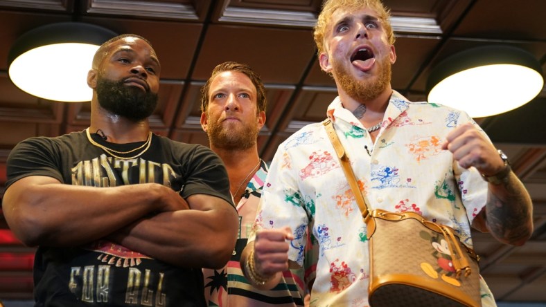 Jun 3, 2021; Miami Beach, Florida, USA; Professional MMA fighter Tyron Woodley and YouTube star Jake Paul face off in front of Bar Stool Sports founder Dave Portnoy at World Famous 5th St. Gym. Mandatory Credit: Jasen Vinlove-USA TODAY Sports