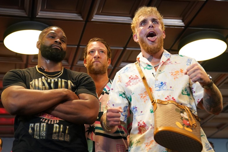 Jun 3, 2021; Miami Beach, Florida, USA; Professional MMA fighter Tyron Woodley and YouTube star Jake Paul face off in front of Bar Stool Sports founder Dave Portnoy at World Famous 5th St. Gym. Mandatory Credit: Jasen Vinlove-USA TODAY Sports