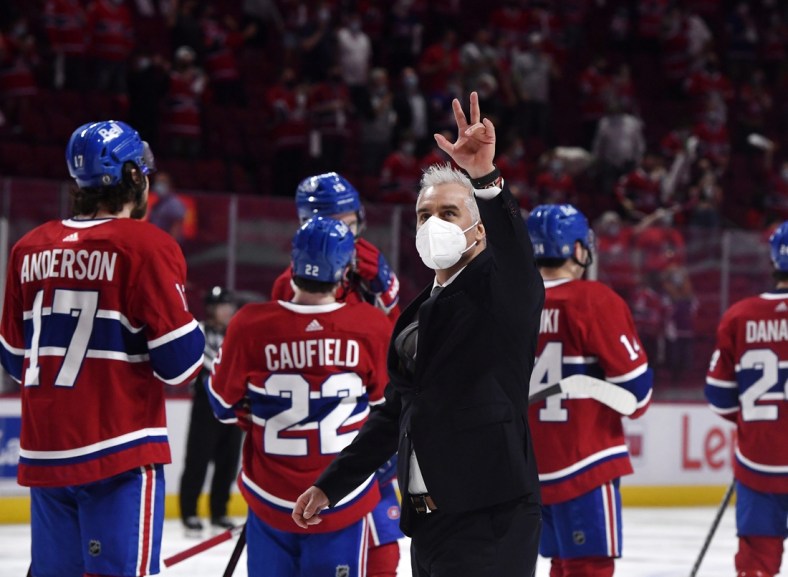 Jun 7, 2021; Montreal, Quebec, CAN; Montreal Canadiens head coach Dominique Ducharme gestures to the fans after the series win over the Winnipeg Jets during the overtime period in game four of the second round of the 2021 Stanley Cup Playoffs at the Bell Centre. Mandatory Credit: Eric Bolte-USA TODAY Sports