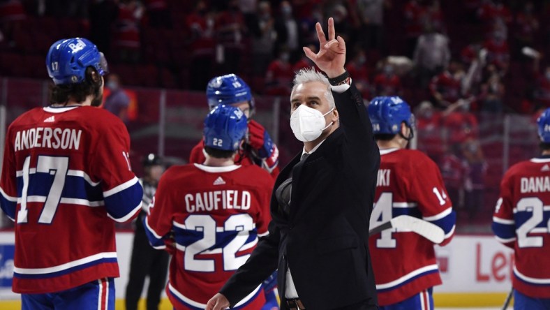 Jun 7, 2021; Montreal, Quebec, CAN; Montreal Canadiens head coach Dominique Ducharme gestures to the fans after the series win over the Winnipeg Jets during the overtime period in game four of the second round of the 2021 Stanley Cup Playoffs at the Bell Centre. Mandatory Credit: Eric Bolte-USA TODAY Sports