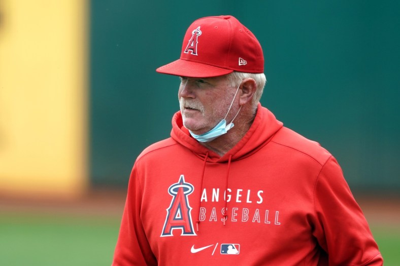 May 29, 2021; Oakland, California, USA; Los Angeles Angels bullpen coach Dom Chiti (84) stands on the field before the game against the Oakland Athletics at RingCentral Coliseum. Mandatory Credit: Darren Yamashita-USA TODAY Sports