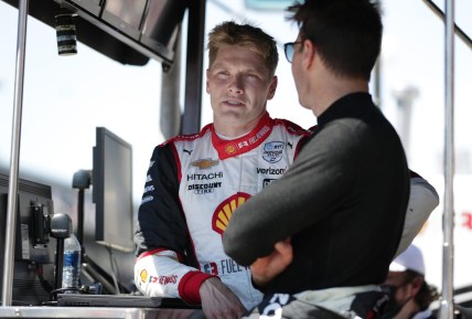 Team Penske drivers Josef Newgarden (2)  and Will Power (12) talk Sunday, May 30, 2021, after the 105th running of the Indianapolis 500 at Indianapolis Motor Speedway.