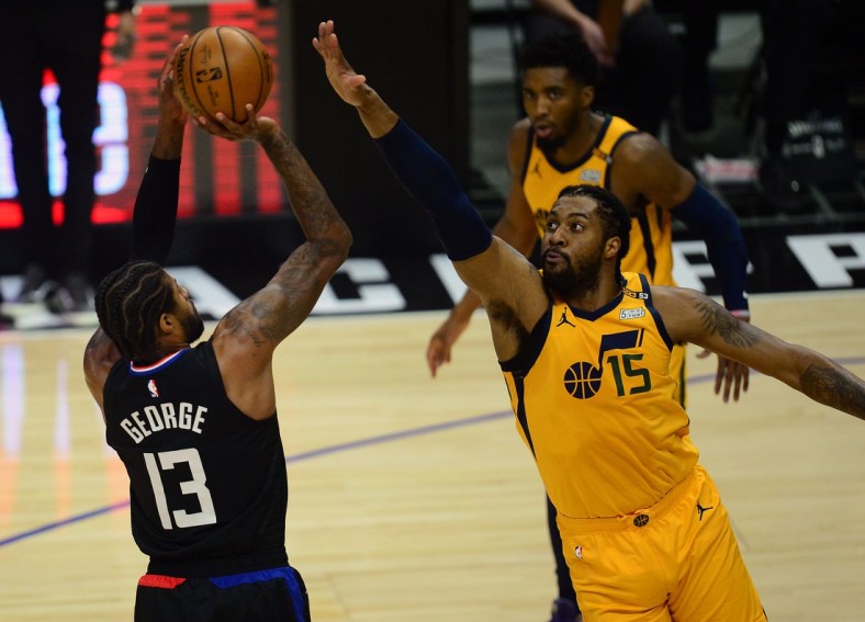 Jun 14, 2021; Los Angeles, California, USA; Los Angeles Clippers guard Paul George (13) shoots against Utah Jazz center Derrick Favors (15) during the first half in game four in the second round of the 2021 NBA Playoffs. at Staples Center. Mandatory Credit: Gary A. Vasquez-USA TODAY Sports