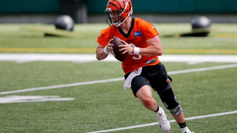 Bengals quarterback Joe Burrow scrambles during a minicamp practice at Paul Brown Stadium in Cincinnati on Tuesday.

Cincinnati Bengals Mini Camp