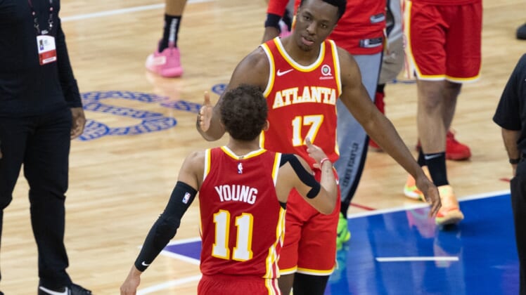 Jun 16, 2021; Philadelphia, Pennsylvania, USA; Atlanta Hawks guard Trae Young (11) shakes hands with forward Onyeka Okongwu (17) after a victory against the Philadelphia 76ers in game five of the second round of the 2021 NBA Playoffs at Wells Fargo Center. Mandatory Credit: Bill Streicher-USA TODAY Sports