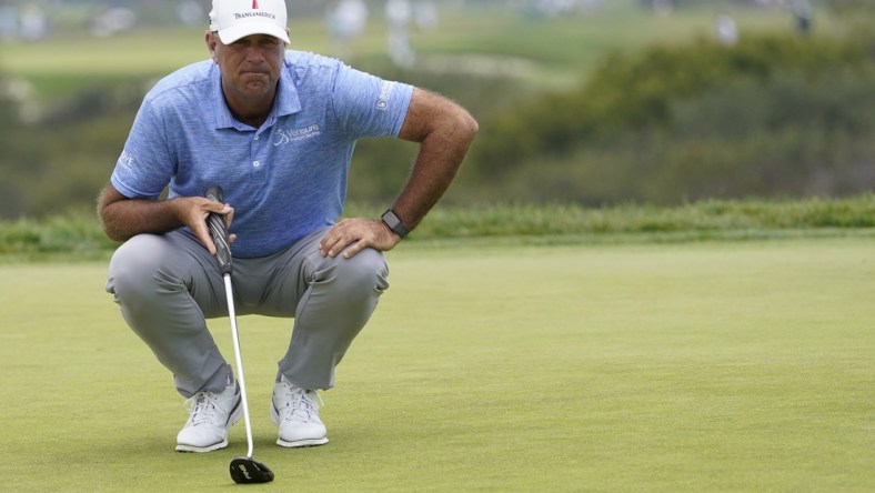 Jun 18, 2021; San Diego, California, USA; Stewart Cink lines up a putt on the 13th green during the second round of the U.S. Open golf tournament at Torrey Pines Golf Course. Mandatory Credit: Michael Madrid-USA TODAY Sports