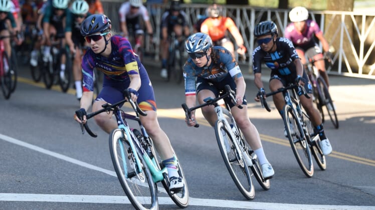 Cyclists round a corner during the women's 2021 USA Cycling Pro Criterium National Championships in downtown Knoxville Friday, June 18, 2021.Usacycling0618 0325