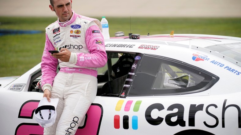 NASCAR Xfinity Series driver Austin Cindric (22) checks his phone prior to the Tennessee Lottery 250 NASCAR Xfinity Series race at the Nashville Superspeedway in Lebanon, Tenn., Saturday, June 19, 2021.

Nascar X 002