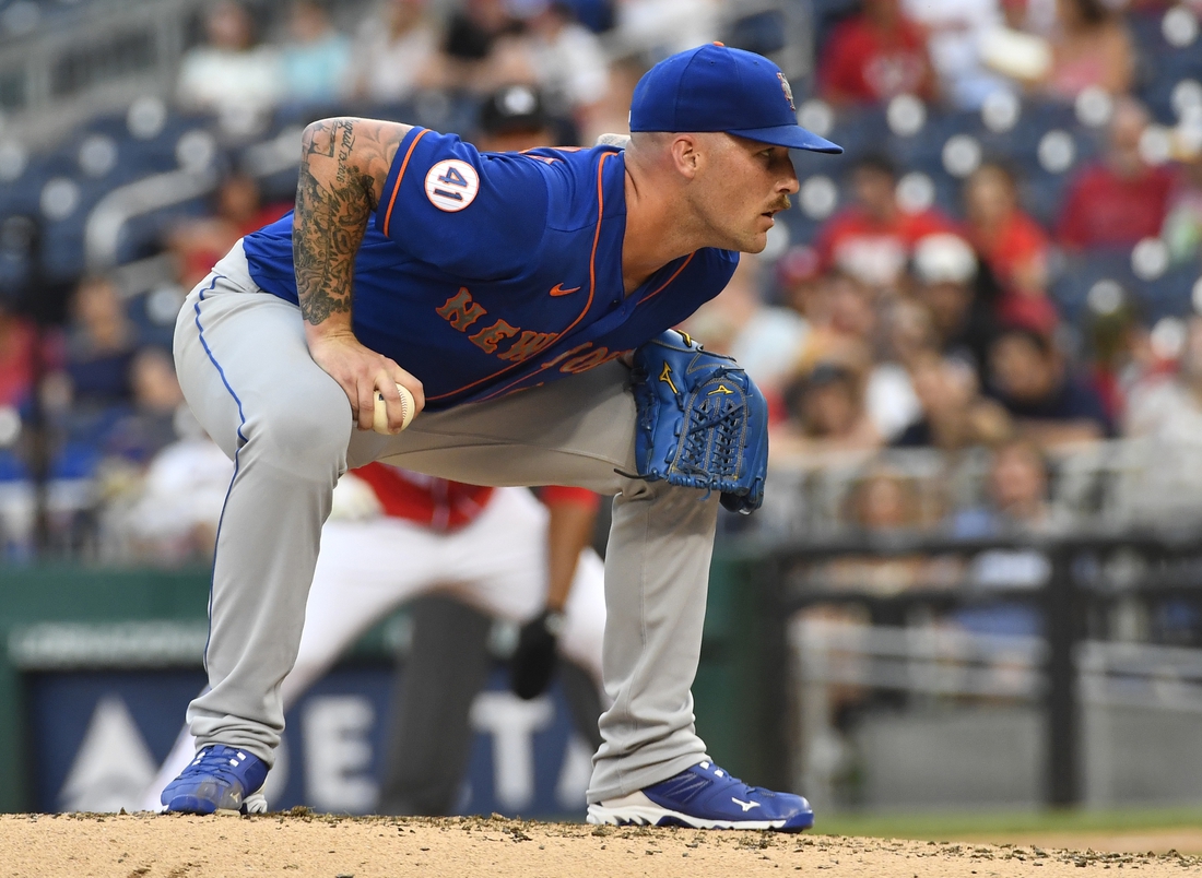 Jun 19, 2021; Washington, District of Columbia, USA; New York Mets relief pitcher Sean Reid-Foley (61) prepares to pitch to the Washington Nationals during the third inning at Nationals Park. Mandatory Credit: Brad Mills-USA TODAY Sports