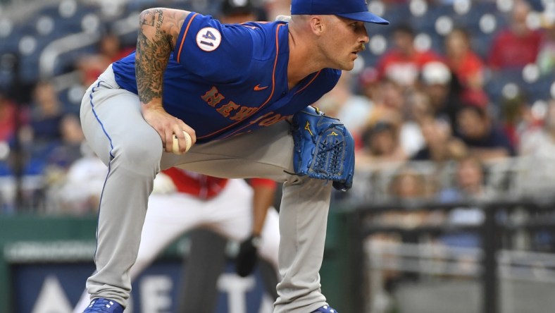 Jun 19, 2021; Washington, District of Columbia, USA; New York Mets relief pitcher Sean Reid-Foley (61) prepares to pitch to the Washington Nationals during the third inning at Nationals Park. Mandatory Credit: Brad Mills-USA TODAY Sports