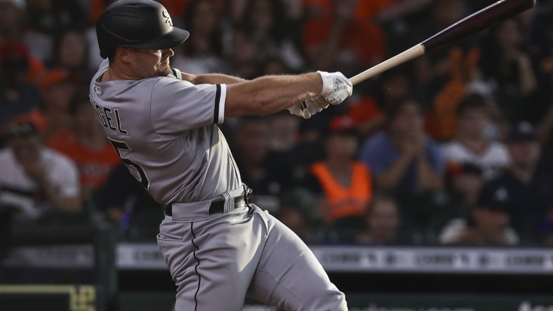 Jun 19, 2021; Houston, Texas, USA; Chicago White Sox center fielder Adam Engel (15) hits a single during the third inning against the Houston Astros at Minute Maid Park. Mandatory Credit: Troy Taormina-USA TODAY Sports