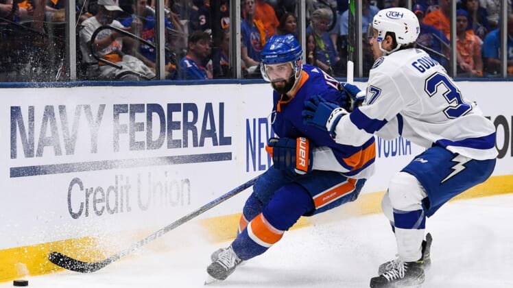 Jun 19, 2021; Uniondale, New York, USA; New York Islanders defenseman Nick Leddy (2) brings the puck from around the back the net defended by Tampa Bay Lightning center Yanni Gourde (37) during the third period in game four of the 2021 Stanley Cup Semifinals at Nassau Veterans Memorial Coliseum. Mandatory Credit: Dennis Schneidler-USA TODAY Sports