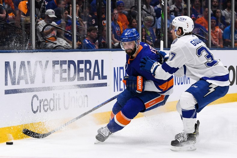 Jun 19, 2021; Uniondale, New York, USA; New York Islanders defenseman Nick Leddy (2) brings the puck from around the back the net defended by Tampa Bay Lightning center Yanni Gourde (37) during the third period in game four of the 2021 Stanley Cup Semifinals at Nassau Veterans Memorial Coliseum. Mandatory Credit: Dennis Schneidler-USA TODAY Sports