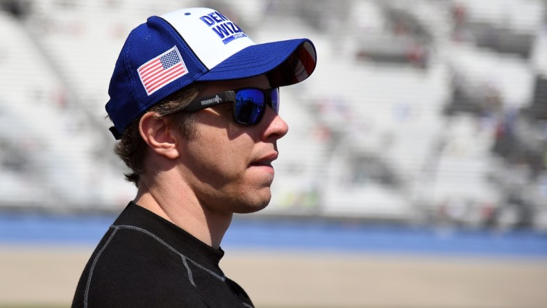 Jun 20, 2021; Nashville, Tennessee, USA; NASCAR Cup Series driver Brad Keselowski (2) waits beside his car before qualifying for the Ally 400 at Nashville Superspeedway. Mandatory Credit: Christopher Hanewinckel-USA TODAY Sports