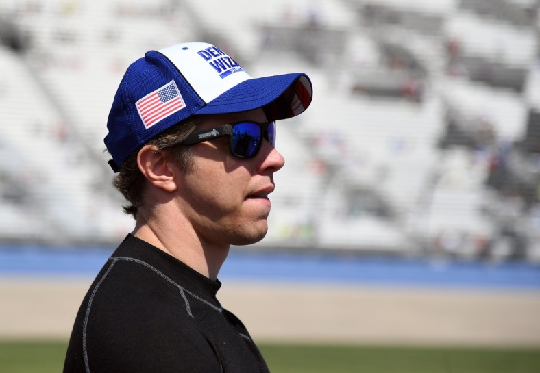 Jun 20, 2021; Nashville, Tennessee, USA; NASCAR Cup Series driver Brad Keselowski (2) waits beside his car before qualifying for the Ally 400 at Nashville Superspeedway. Mandatory Credit: Christopher Hanewinckel-USA TODAY Sports