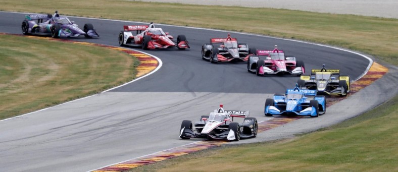 Josef Newgarden (2) leads a pack of cars through turn 1 during the NTT IndyCar Rev Group Grand Prix, Sunday, June 20, 2021, at Elkhart Lake's Road America near Plymouth, Wis.

She 062021 Rev Group Grand Prix Road America Gck 008