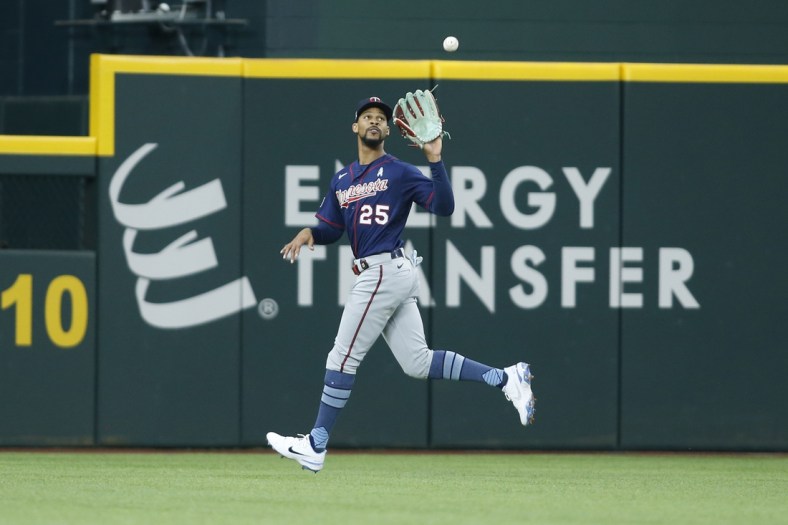 Jun 20, 2021; Arlington, Texas, USA; Minnesota Twins center fielder Byron Buxton (25) catches a fly ball in the fourth inning against the Texas Rangers at Globe Life Field. Mandatory Credit: Tim Heitman-USA TODAY Sports