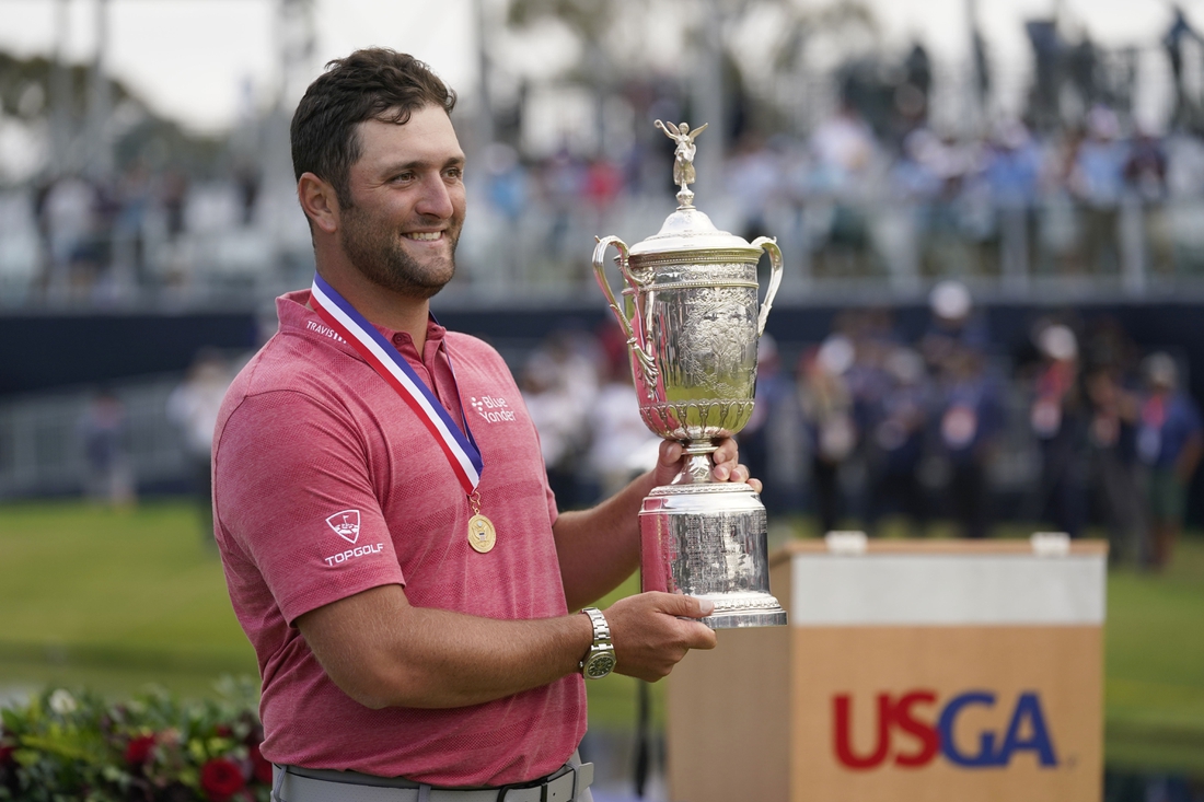 Jun 20, 2021; San Diego, California, USA; Jon Rahm celebrates with the trophy after winning he U.S. Open golf tournament at Torrey Pines Golf Course. Mandatory Credit: Michael Madrid-USA TODAY Sports