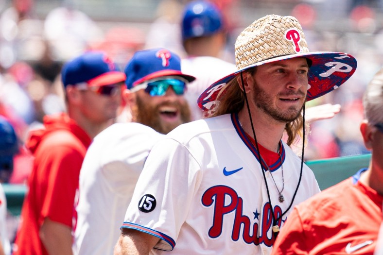 Jun 23, 2021; Philadelphia, Pennsylvania, USA; Philadelphia Phillies center fielder Travis Jankowski (9) wears a ceremonial hat in the dugout after hitting a three RBI home run against the Washington Nationals during the second inning at Citizens Bank Park. Mandatory Credit: Bill Streicher-USA TODAY Sports