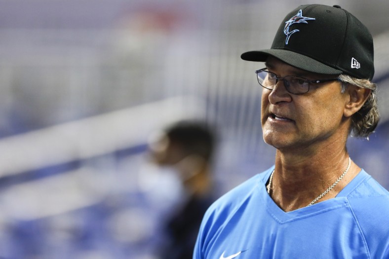 Jun 23, 2021; Miami, Florida, USA; Miami Marlins manager Don Mattingly (8) looks on from the field during batting practice prior the game against the Toronto Blue Jays at loanDepot Park. Mandatory Credit: Sam Navarro-USA TODAY Sports