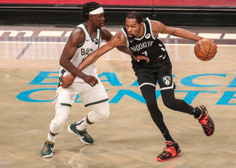 Jun 19, 2021; Brooklyn, New York, USA; Milwaukee Bucks  guard Jrue Holiday (21) and Brooklyn Nets forward Kevin Durant (7) during game seven in the second round of the 2021 NBA Playoffs at Barclays Center. Mandatory Credit: Wendell Cruz-USA TODAY Sports