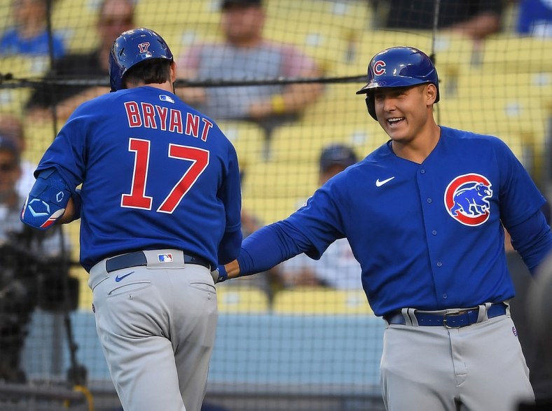 Jun 25, 2021; Los Angeles, California, USA;  Chicago Cubs third baseman Kris Bryant (17) is greeted by first baseman Anthony Rizzo (44) after hitting a solo home run in the first inning of the game against the Los Angeles Dodgers at Dodger Stadium. Mandatory Credit: Jayne Kamin-Oncea-USA TODAY Sports