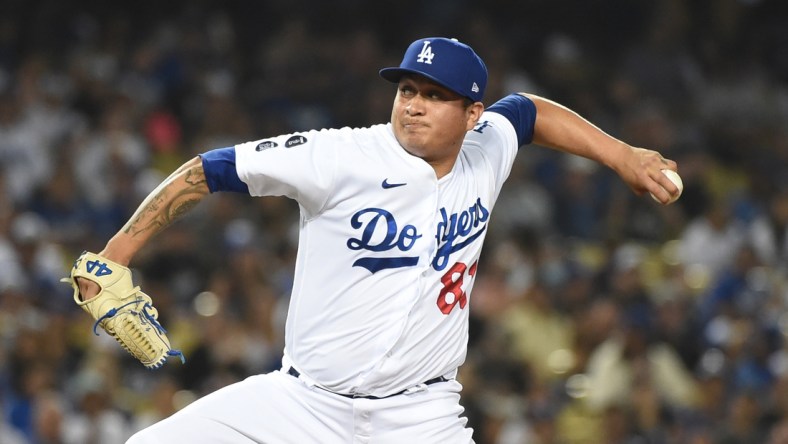 Jun 28, 2021; Los Angeles, California, USA;  Los Angeles Dodgers starting pitcher Victor Gonzalez (81) pitches against the San Francisco Giants in the seventh inning at Dodger Stadium. Mandatory Credit: Richard Mackson-USA TODAY Sports