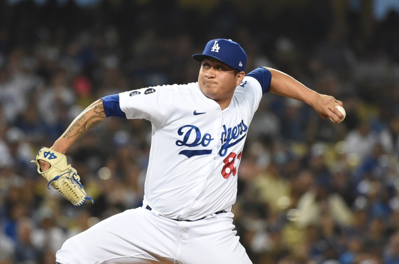 Jun 28, 2021; Los Angeles, California, USA;  Los Angeles Dodgers starting pitcher Victor Gonzalez (81) pitches against the San Francisco Giants in the seventh inning at Dodger Stadium. Mandatory Credit: Richard Mackson-USA TODAY Sports