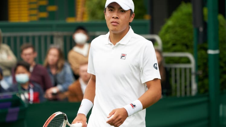 Jun 29, 2021; London, United Kingdom; Brandon Nakashima  (USA) seen on court against compatriot  Taylor Fritz (USA) in first round  singles on No. 16 court at All England Lawn Tennis and Croquet Club. Fritz ran out the winner 7-5  3-6  6-6  7-5.  Mandatory Credit: Peter van den Berg-USA TODAY Sports