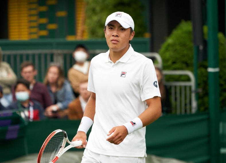 Jun 29, 2021; London, United Kingdom; Brandon Nakashima  (USA) seen on court against
 compatriot  Taylor Fritz (USA) in first round  singles on No. 16 court at All England Lawn 
Tennis and Croquet Club. Fritz ran out the winner 7-5  3-6  6-6  7-5.  Mandatory Credit: Peter van den Berg-USA TODAY Sports