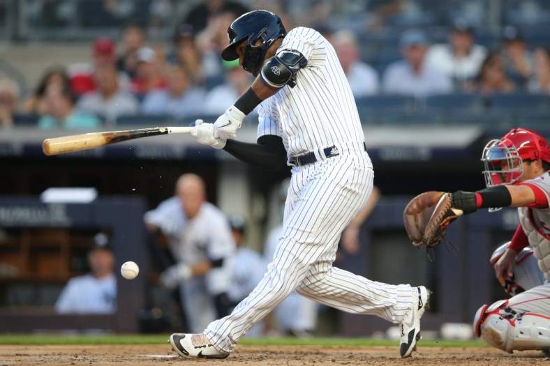 Jun 30, 2021; Bronx, New York, USA; New York Yankees left fielder Miguel Andujar (41) breaks his bat as he hits into an RBI fielder's choice during the first inning against the Los Angeles Angels at Yankee Stadium. Mandatory Credit: Brad Penner-USA TODAY Sports