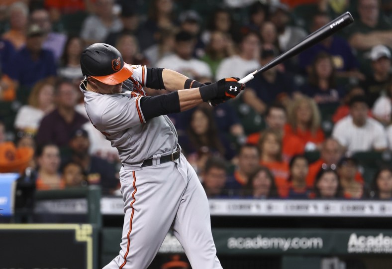 Jun 30, 2021; Houston, Texas, USA; Baltimore Orioles designated hitter Ryan Mountcastle (6) hits an RBI double during the first inning against the Houston Astros at Minute Maid Park. Mandatory Credit: Troy Taormina-USA TODAY Sports