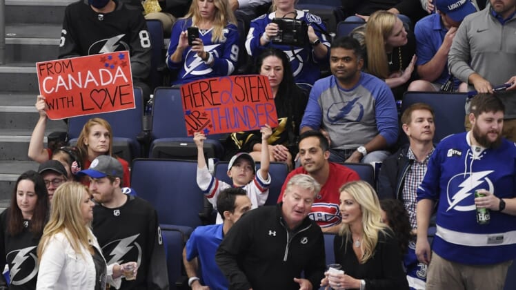 Jun 30, 2021; Tampa, Florida, USA; Montreal Canadiens fans sit between Tampa Bay Lightning fans during the third period in game two of the 2021 Stanley Cup Final at Amalie Arena. Mandatory Credit: Douglas DeFelice-USA TODAY Sports