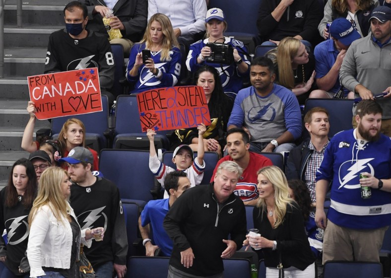 Jun 30, 2021; Tampa, Florida, USA; Montreal Canadiens fans sit between Tampa Bay Lightning fans during the third period in game two of the 2021 Stanley Cup Final at Amalie Arena. Mandatory Credit: Douglas DeFelice-USA TODAY Sports