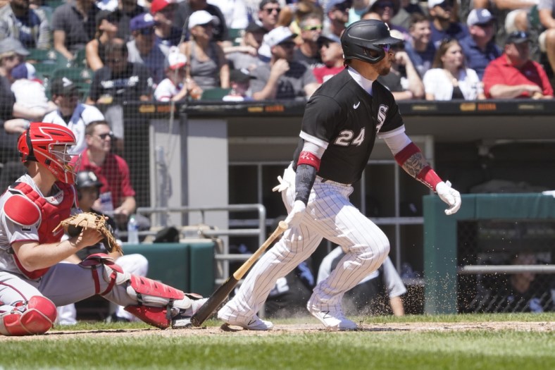 Jul 1, 2021; Chicago, Illinois, USA; Chicago White Sox first baseman Yasmani Grandal (24)hits a1 one run single against the Minnesota Twins during the third inning at Guaranteed Rate Field. Mandatory Credit: David Banks-USA TODAY Sports