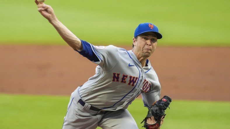 Jul 1, 2021; Cumberland, Georgia, USA; New York Mets starting pitcher Jacob deGrom (48) pitches against the Atlanta Braves during the first inning at Truist Park. Mandatory Credit: Dale Zanine-USA TODAY Sports