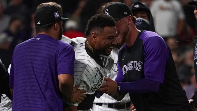 Jul 1, 2021; Denver, Colorado, USA; Colorado Rockies catcher Elias Diaz (35) celebrates a three-run walk-off home run against the St. Louis Cardinals during the ninth inning at Coors Field. Mandatory Credit: Troy Babbitt-USA TODAY Sports