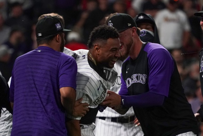Jul 1, 2021; Denver, Colorado, USA; Colorado Rockies catcher Elias Diaz (35) celebrates a three-run walk-off home run against the St. Louis Cardinals during the ninth inning at Coors Field. Mandatory Credit: Troy Babbitt-USA TODAY Sports