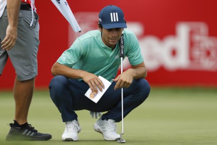 Jul 2, 2021; Detroit, Michigan, USA; Joaquin Niemann reads his putt on the 17th hole during the second round of the Rocket Mortgage Classic golf tournament. Mandatory Credit: Raj Mehta-USA TODAY Sports