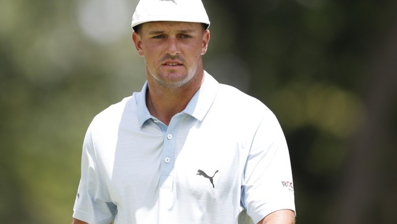 Jul 2, 2021; Detroit, Michigan, USA; Bryson DeChambeau walks on the 9th green during the second round of the Rocket Mortgage Classic golf tournament. Mandatory Credit: Raj Mehta-USA TODAY Sports