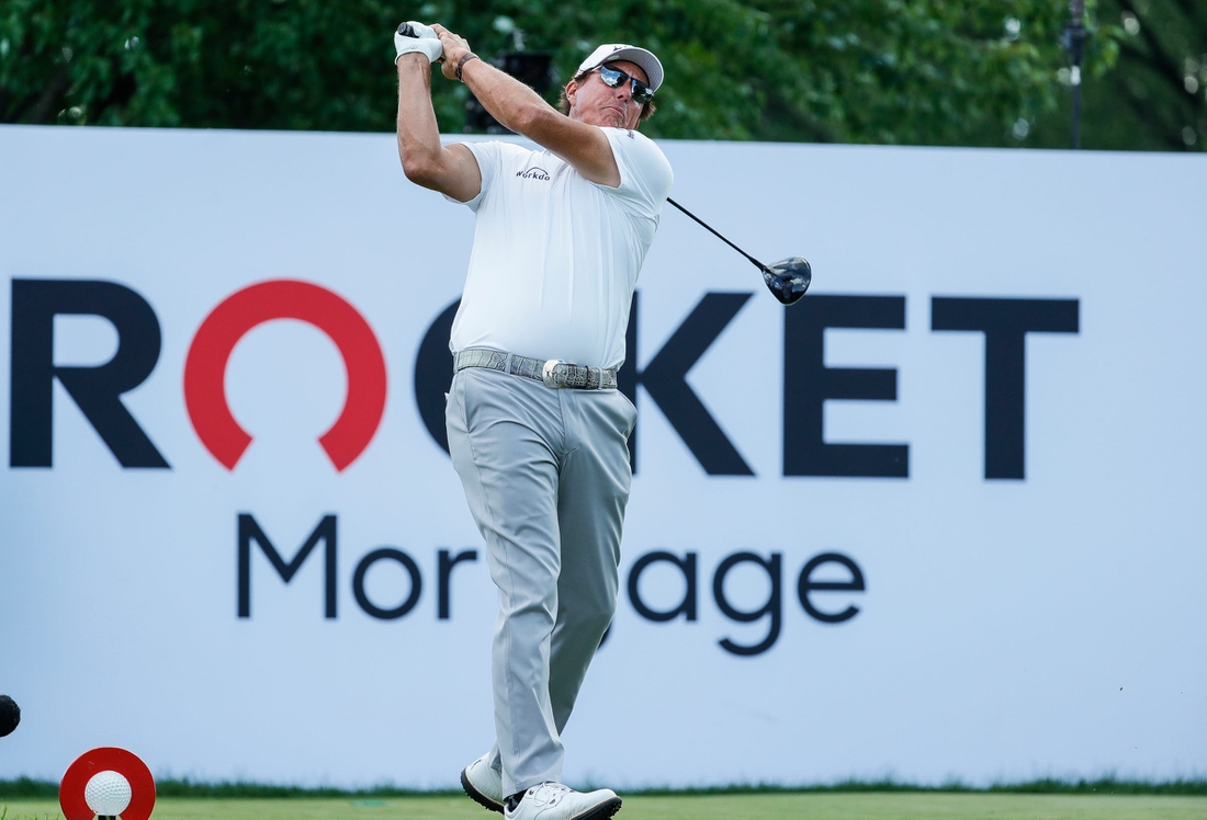 Phil Mickelson tees off on the 18th during the second round of the Rocket Mortgage Classic at the Detroit Golf Club in Detroit on Friday, July 2, 2021.