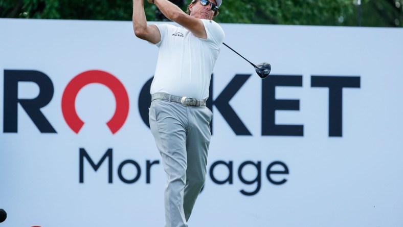 Phil Mickelson tees off on the 18th during the second round of the Rocket Mortgage Classic at the Detroit Golf Club in Detroit on Friday, July 2, 2021.