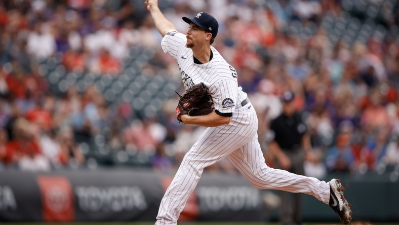 Jul 2, 2021; Denver, Colorado, USA; Colorado Rockies starting pitcher Chi Chi Gonzalez (50) pitches in the first inning against the St. Louis Cardinals at Coors Field. Mandatory Credit: Isaiah J. Downing-USA TODAY Sports