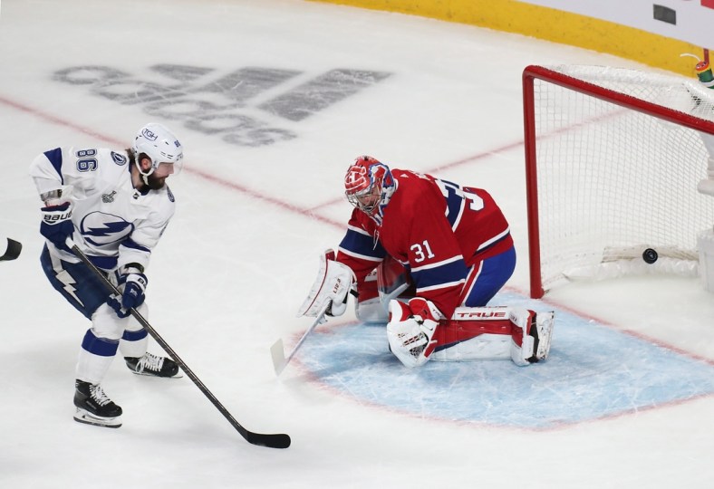 Jul 2, 2021; Montreal, Quebec, CAN; Montreal Canadiens goaltender Carey Price (31) defends the net against Tampa Bay Lightning right wing Nikita Kucherov (86) during the first period in game three of the 2021 Stanley Cup Final at Bell Centre. Mandatory Credit: Jean-Yves Ahern-USA TODAY Sports