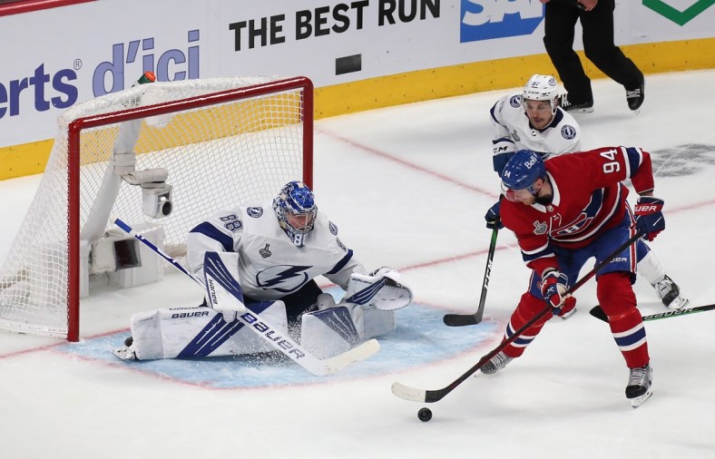 Jul 2, 2021; Montreal, Quebec, CAN; Tampa Bay Lightning goaltender Andrei Vasilevskiy (88) defends the net against Montreal Canadiens right wing Corey Perry (94) during the third period in game three of the 2021 Stanley Cup Final at Bell Centre. Mandatory Credit: Jean-Yves Ahern-USA TODAY Sports