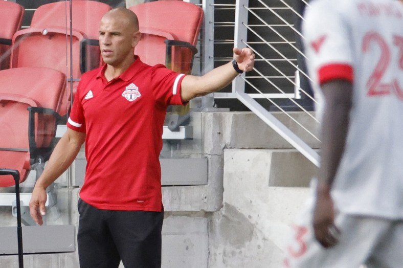 Jul 3, 2021; Washington, DC, USA; Toronto FC head coach Chris Armas gestures from the bench against D.C. United in the second half at Audi Field. Mandatory Credit: Geoff Burke-USA TODAY Sports