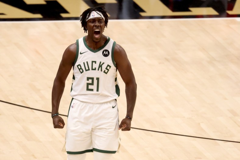 Jul 3, 2021; Atlanta, Georgia, USA; Milwaukee Bucks guard Jrue Holiday (21) reacts after a basket during the first quarter against the Atlanta Hawks in game six of the Eastern Conference Finals for the 2021 NBA Playoffs at State Farm Arena. Mandatory Credit: Jason Getz-USA TODAY Sports