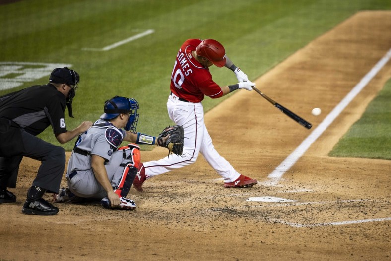 Jul 3, 2021; Washington, District of Columbia, USA; Washington Nationals catcher Yan Gomes (10) hits a three-run home run against the Los Angeles Dodgers during the fourth inning at Nationals Park. Mandatory Credit: Scott Taetsch-USA TODAY Sports